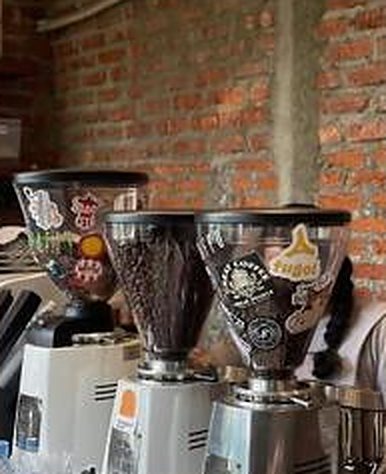 Sticker-covered coffee grinders